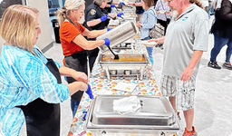 group of people at empty bowls recap