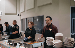 group of people at empty bowls recap
